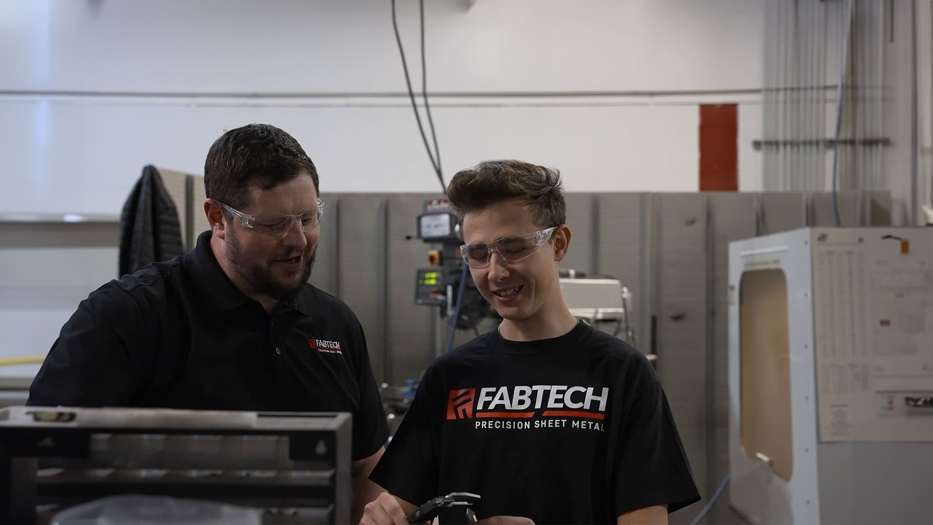 An AJAC Youth Apprentice works alongside his mentor at Fabtech Precision Sheet Metal in Spokane Valley, Washington.