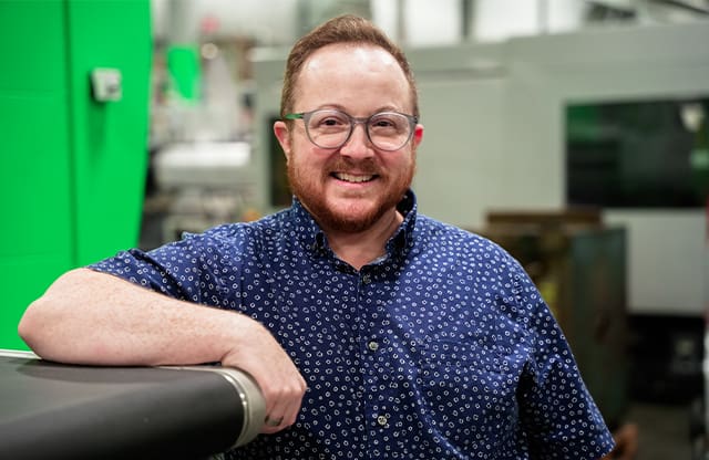 Evan Love pauses for a photo at Tool Gauge in Tacoma, Washington.